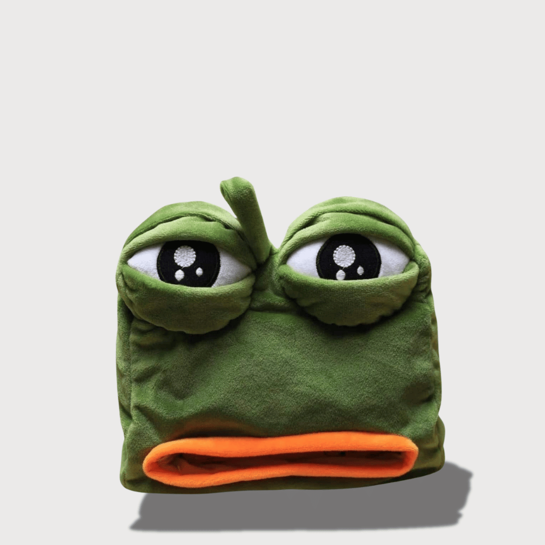 Doudou Grenouille Triste 22 cm 1 Doudou Grenouille Triste 22 cm : Doudou grenouille verte avec de grands yeux expressifs et une bouche orange.