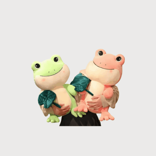 Doudou Grenouille Style Cartoon 25 cm : Deux doudous grenouilles, vert clair et pêche, tenant une feuille verte dans leurs bras.