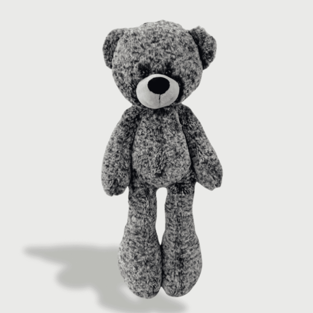 Doudou Ours Noir pour Enfant : Doudou ours noir texturé avec un nez blanc et un regard attendrissant.