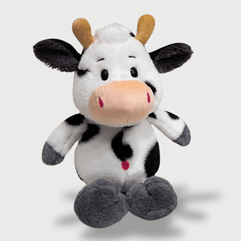 Doudou Vache Style Kawaii : Doudou vache noir et blanc avec des sabots gris, un museau beige et un sourire attendrissant.