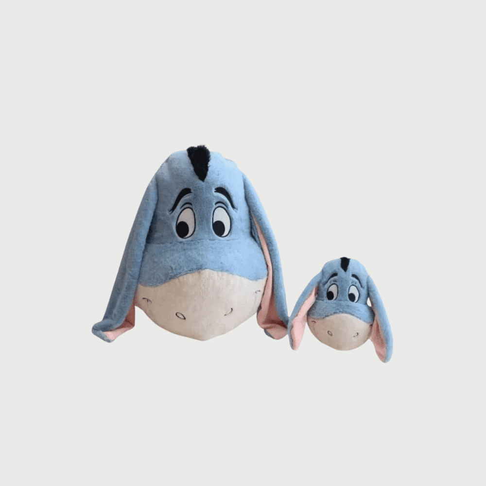 Doudou Bourriquet en Forme de Tête : Deux doudous têtes de Bourriquet en bleu avec oreilles tombantes et regard attachant.