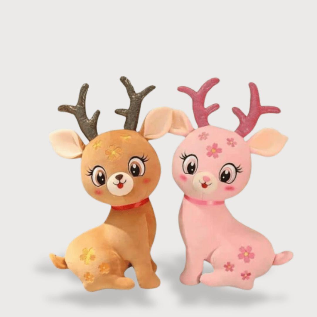 Doudou Biche de Noel Super Mignone 1 Doudou Biche de Noël Super Mignonne : Deux doudous biches, l'un brun avec des cornes marron et l'autre rose avec des cornes roses scintillantes, chacun orné de fleurs.