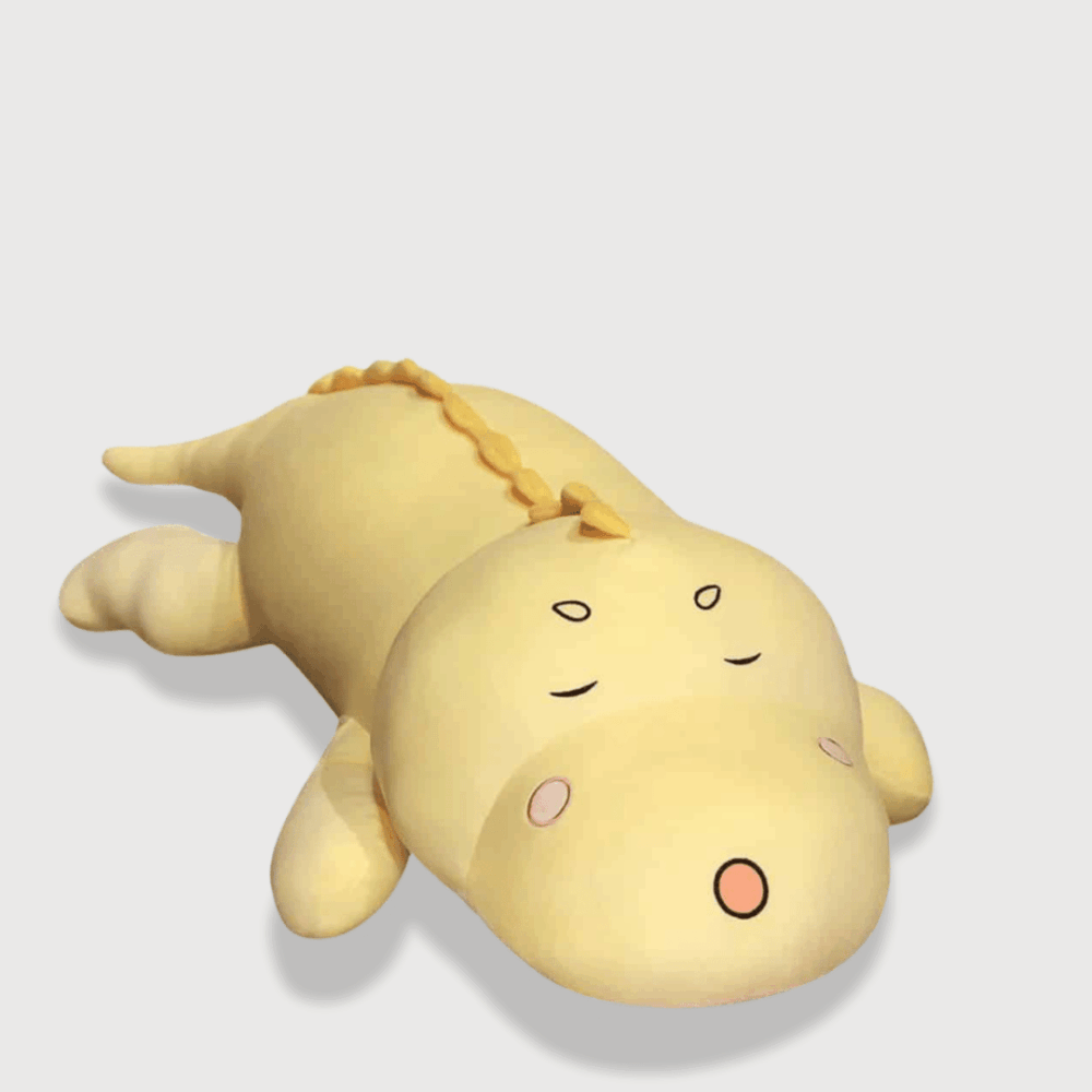 Doudou Dinosaure Géant avec un dinosaure jaune endormi.