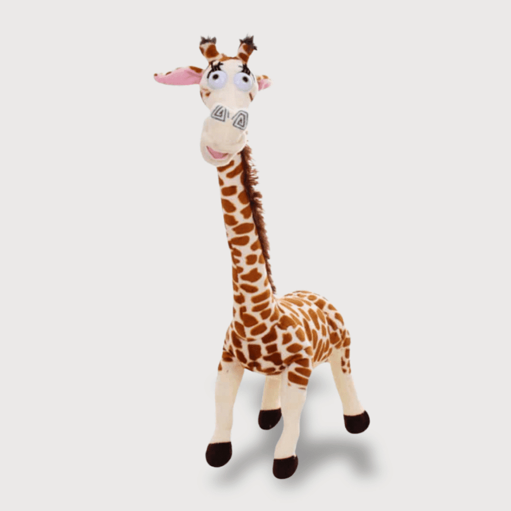 Doudou Girafe de Madagascar avec une girafe debout au long cou et grands yeux expressifs.