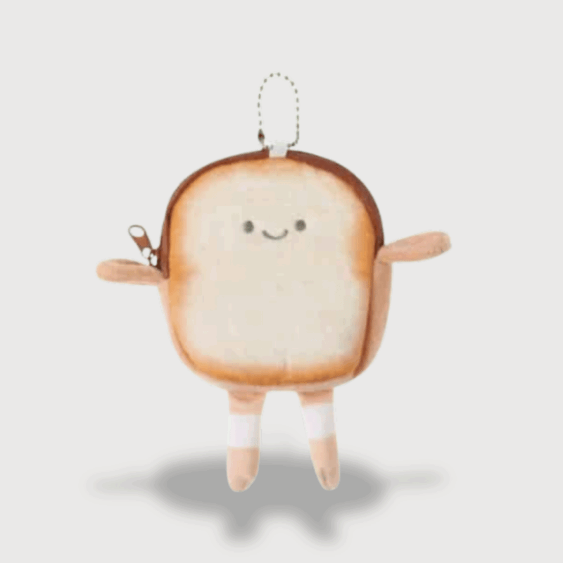 Doudou Adulte Porte-Monnaie Pain : Doudou porte-monnaie en forme de tranche de pain souriante.