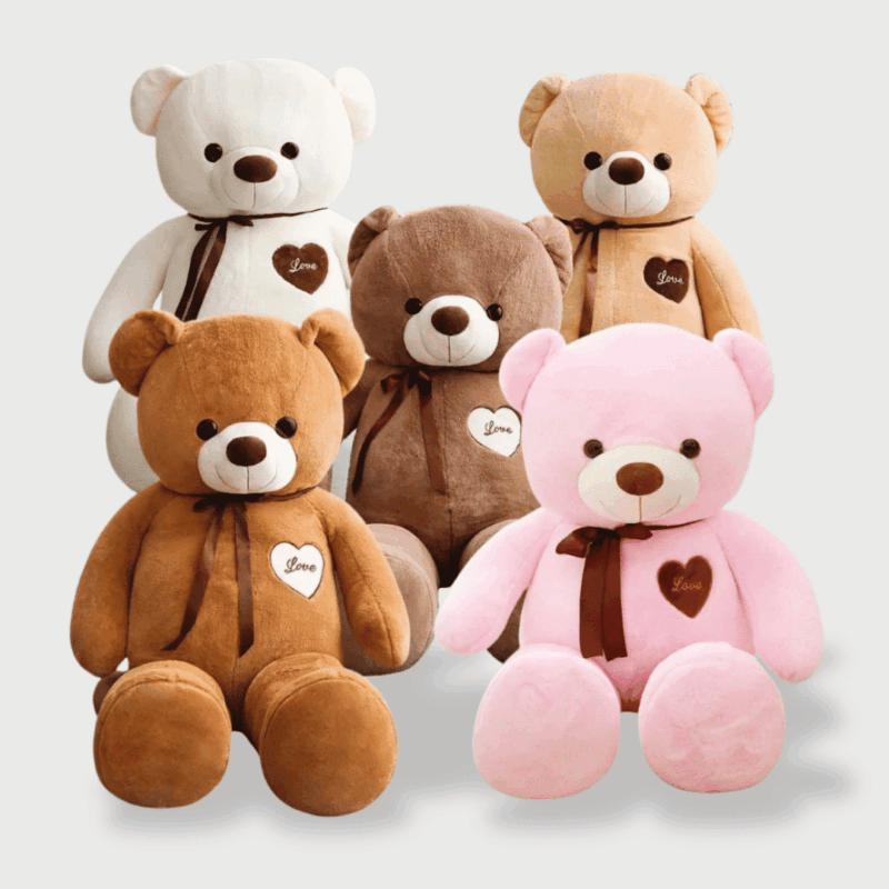 Doudou Géant Ours Câlin 100 cm disponible en plusieurs couleurs : marron, rose, blanc, brun, avec un nœud autour du cou et un cœur brodé.