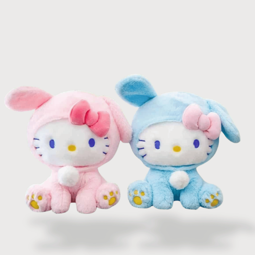 Doudou Kittie Déguisé en Lapin 22 cm avec un costume rose et bleu, des oreilles tombantes et un nœud assorti.