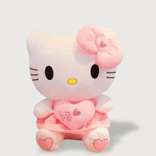 Doudou Kittie Géant de 65 cm : Un grand doudou Hello Kitty rose tenant un coussin en forme de cœur avec l'inscription "LOVE".