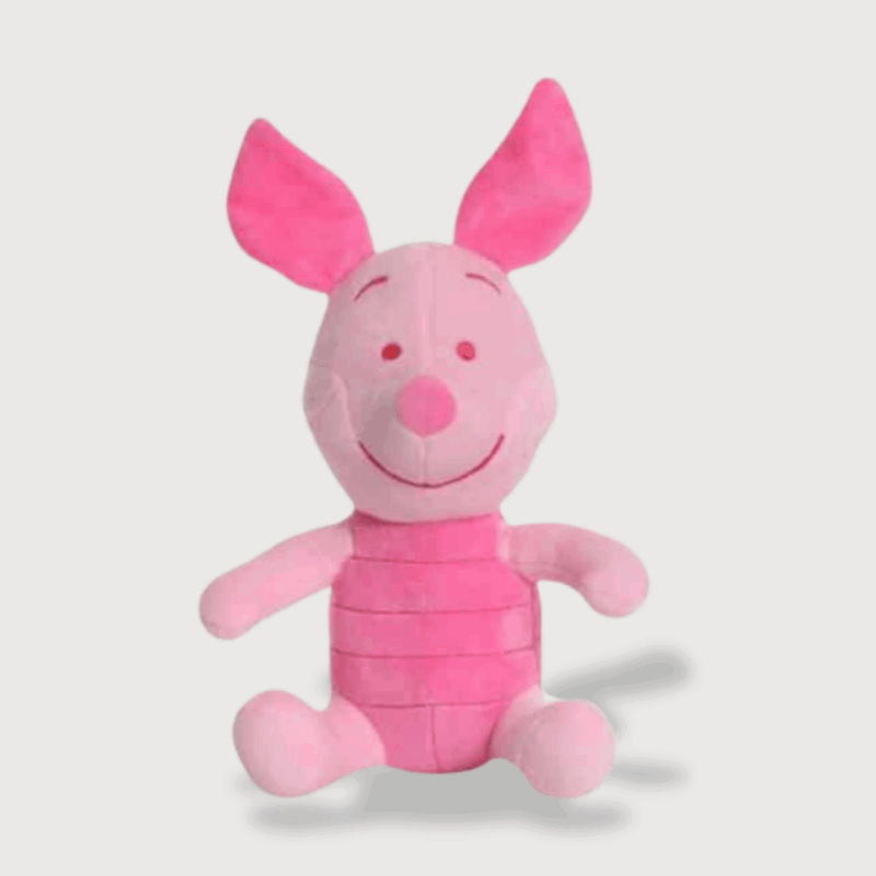 Doudou Rose Porcinet représentant un porcinet debout avec ses oreilles dressées, son sourire tendre et son corps rayé rose.