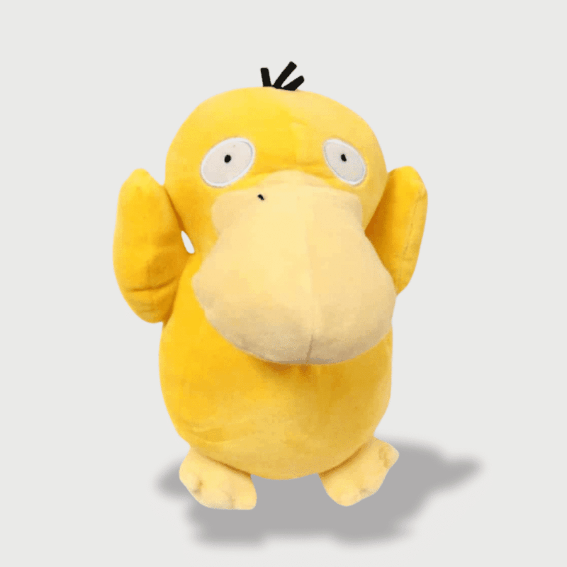 Doudou Pokemon Psykokwak : Un doudou Psykokwak jaune avec un grand bec et des yeux écarquillés, bras levés.