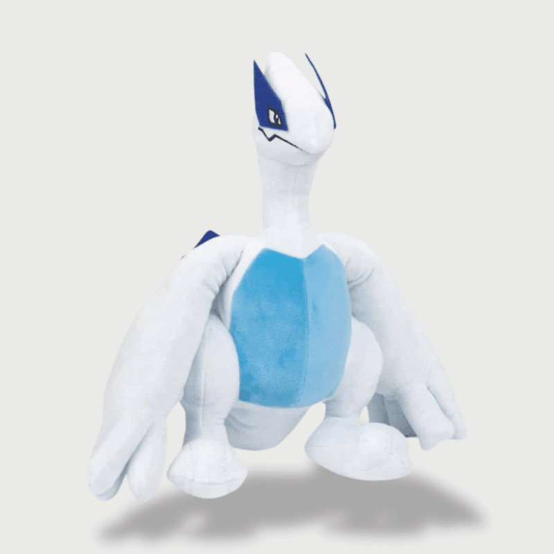 Doudou Pokemon Lugia : Un doudou Lugia blanc et bleu avec de grandes ailes et une posture majestueuse.
