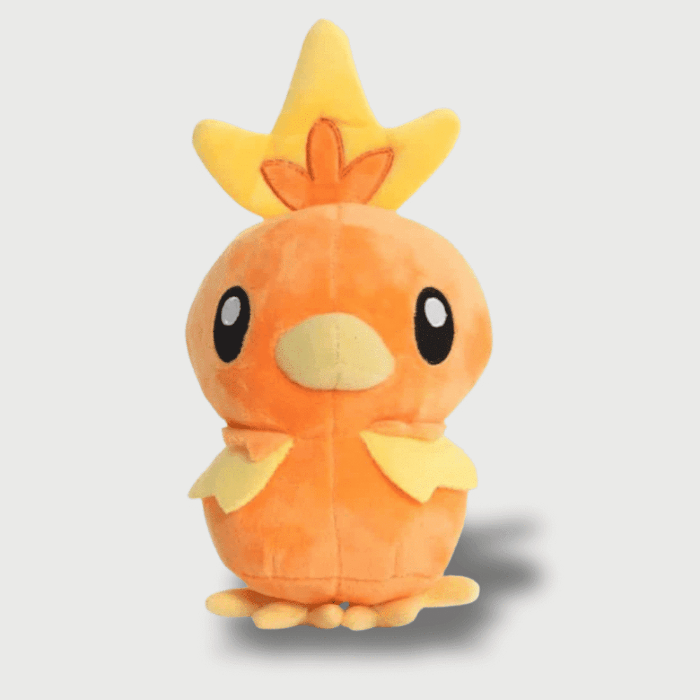 Doudou Pokemon Poussifeu : Un doudou Poussifeu orange avec un bec jaune, une crête sur la tête et de petites ailes.