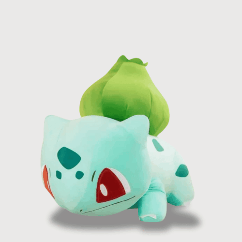 Doudou Pokemon Bulbizarre Géant : Un grand doudou Bulbizarre vert clair avec un bulbe vert sur le dos et des yeux rouges.