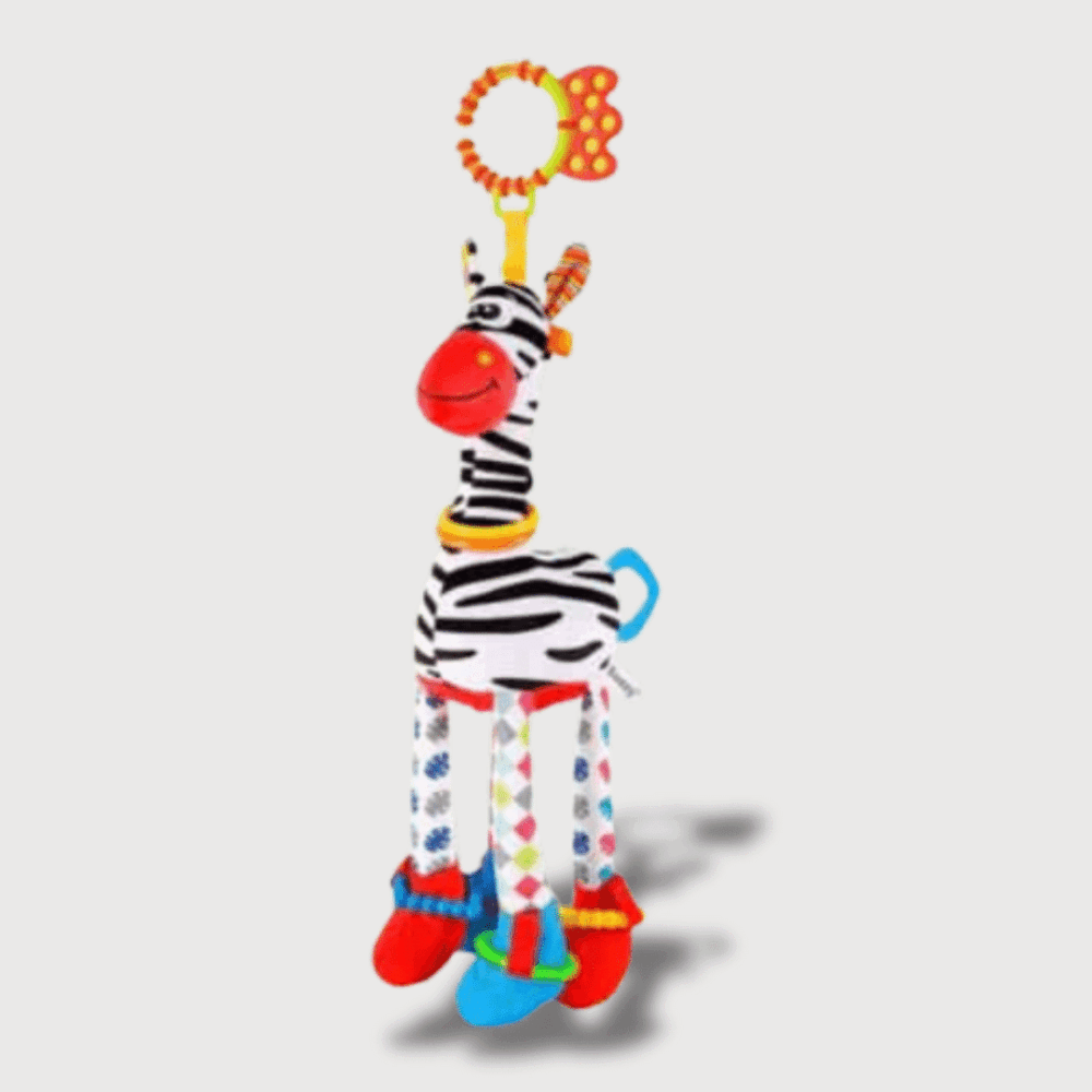 Doudou Musical Zèbre en noir et blanc, avec un museau rouge, des pattes longues et une attache anneau.