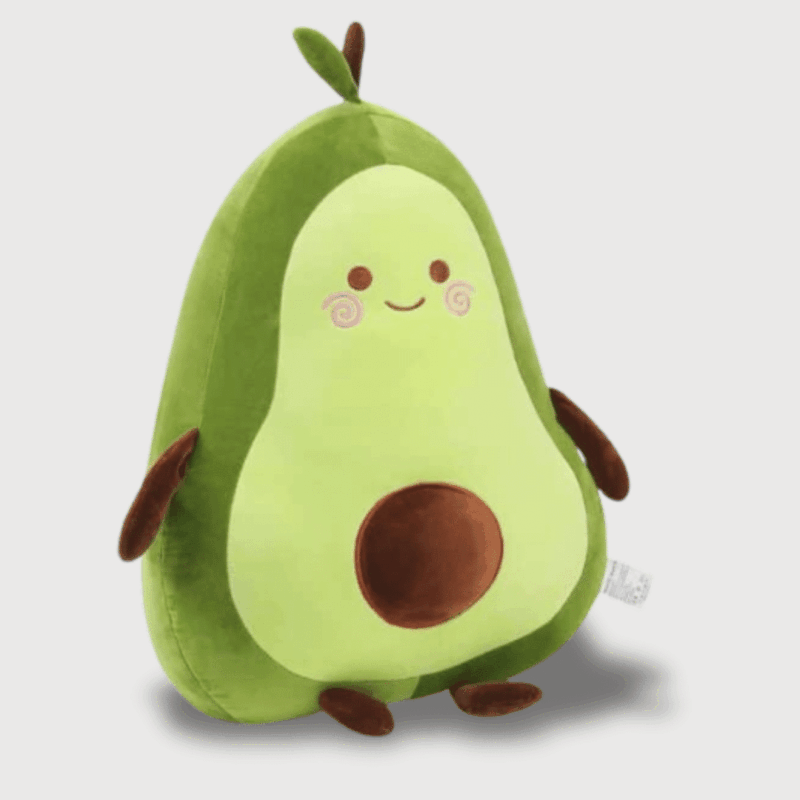 Doudou Avocat Géant Mignon : Un doudou en forme d’avocat vert avec un noyau marron et un visage souriant.