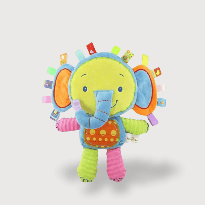 Doudou Musical Éléphant avec de grandes oreilles bleues, un corps coloré, des étiquettes et une trompe joyeuse.